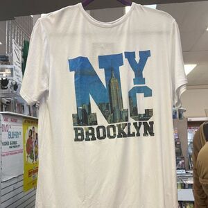 White tee shirt with nyc Brooklyn in words on the front